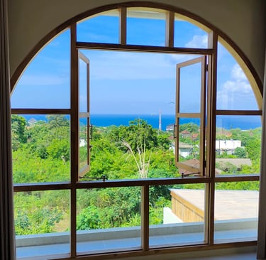 Luxury Bali villa with open window and panoramic ocean view – legal ownership guide for foreigners