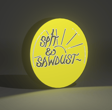 Close-up of a 3D-printed lightbox featuring a bold skate graphic and warm LED lighting.