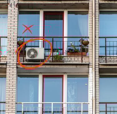 equipò de aire acondicionado colocado en la fachada de un edificio