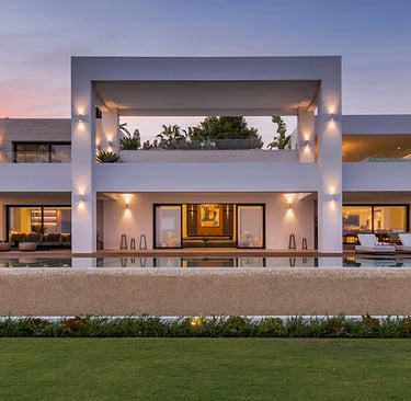 Contemporary beachfront villa façade at sunset