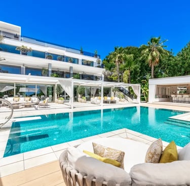 Luxury poolside view of Villa Serenity with palm gardens