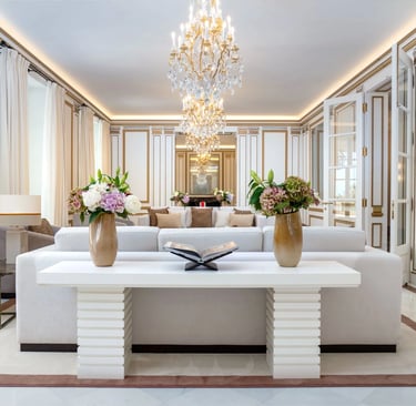 Ornate reception room with gold detailing and chandelier