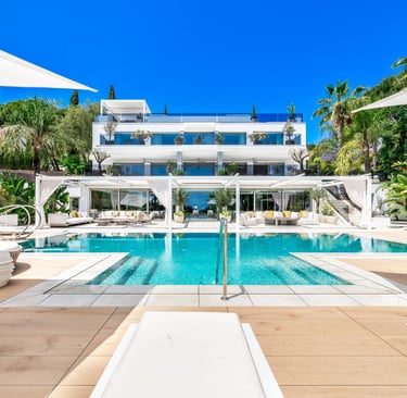 Modern villa exterior with expansive pool area