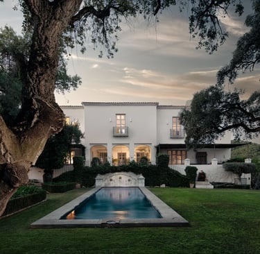 Symmetrical garden with pool at sunset
