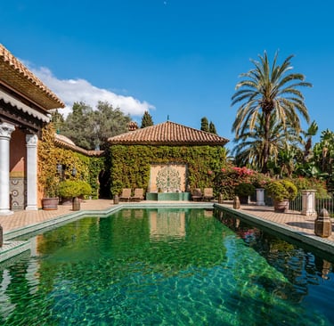 Moorish-style pool courtyard with green tiled swimming pool