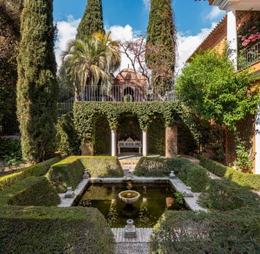 Formal courtyard garden with fountain and manicured hedges