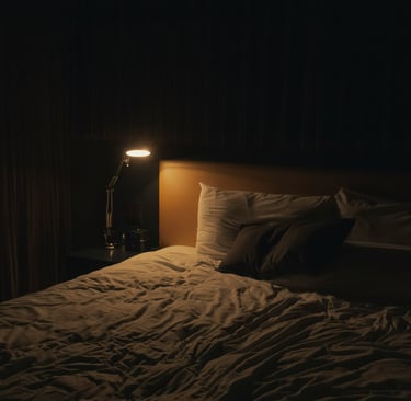 Darkened bedroom with warm lamp lighting promoting natural sleep environment 