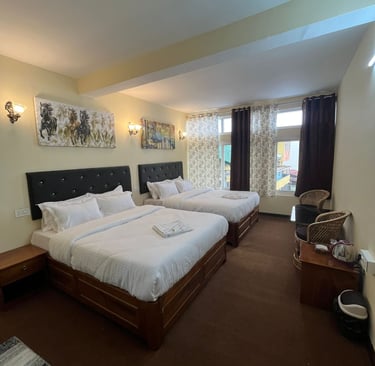 A charming hotel building situated on the bustling Darjeeling Mall Road near Chowrasta Mall