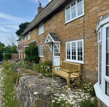 a bench with a bench and a bench in front of a house