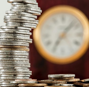 a stack of coins sitting on top of a pile of coins