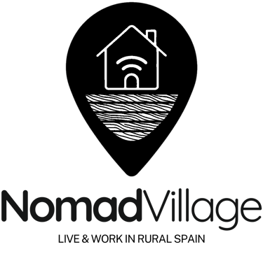 Logotipo de NomadVillage con pin de ubicación, casa con Wi-Fi y base de tierra.