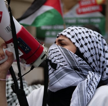 a man in a white shirt and black scarf