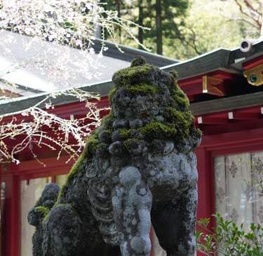 a statue of a lion in Hakone Shrine