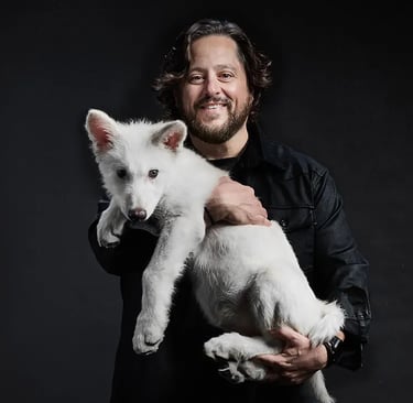 Colossal CEO Ben Lamm with a dire wolf pup.