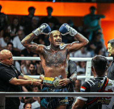 Potrait and belt on his winning Muay thai fight