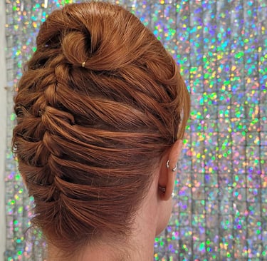 Elegant twisted updo on auburn hair