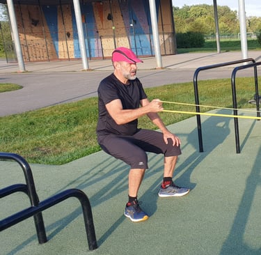 homme squat isométrie élastiques