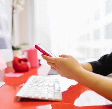woman working email marketing office cellphone computer