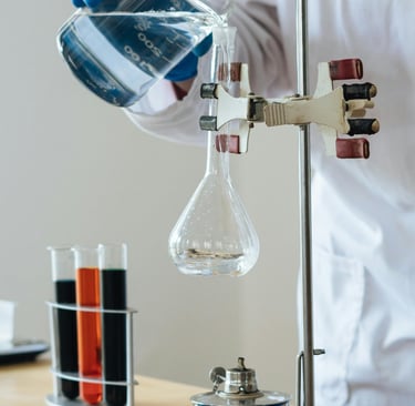 a person in a lab coat is holding a beakle