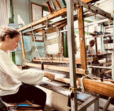 working on a the loom in the handloom factory