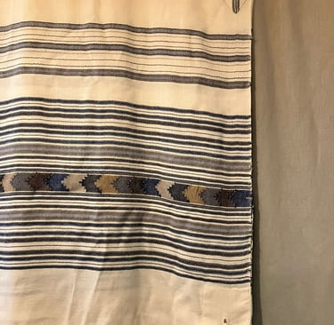 a tallit on a wall
