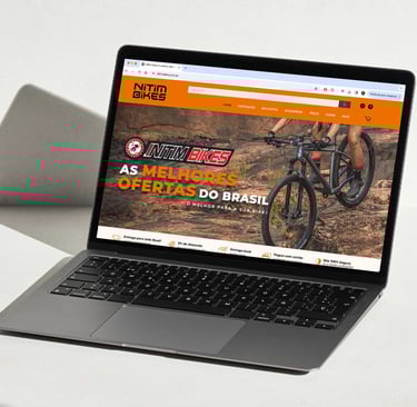 a laptop computer screen showing a website page on the left side of the screen