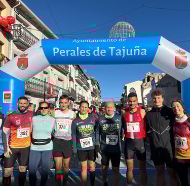 a group of people standing in front of a blue arch