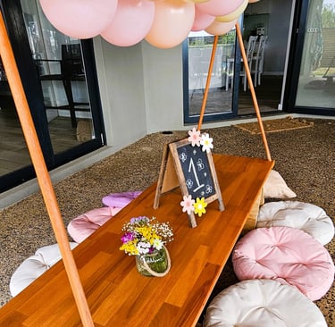 teepee picnic table daisy bloom theme with balloon garland