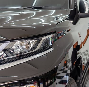 a man is detailing a car