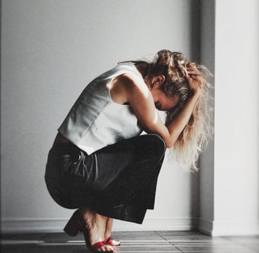 a woman in a white shirt and black pants with disappointment expression