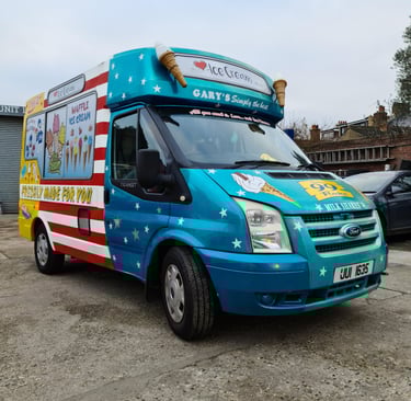 a blue ice cream truck with designs