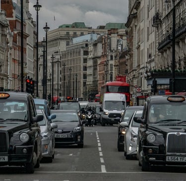 Taxis and other cars waiting in traffic