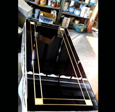 a black and gold table top with a black and gold frame