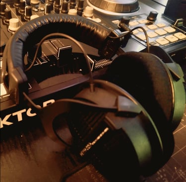 Professional audio editing headphones on DJ controller