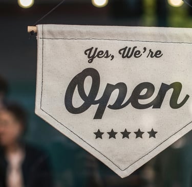 a sign that says yes we're open