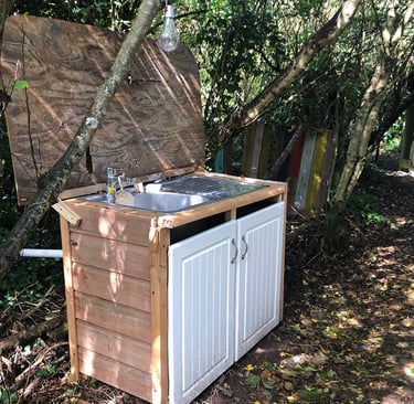 outdoor kitchen sink set in woodland