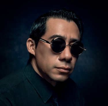 a man in a black shirt and tie dye dye dye dye dye dye dye dye