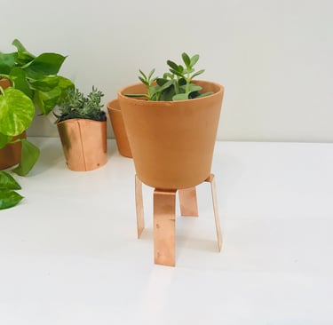 Decorative copper sculpture showcasing natural patina finish