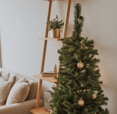 a christmas tree with ornaments and decorations on a table