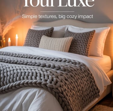 a bed with a blanket and candles on it