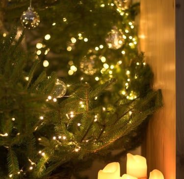 a christmas tree with candles and candles on a table