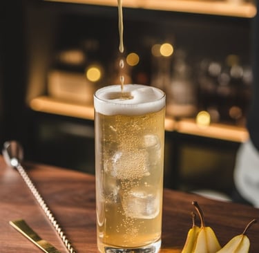 a person pouring a drink into a glass of beer