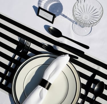 a table setting with a candle and a candle