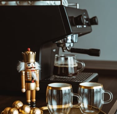 a nutcrawer and coffee cups on a table