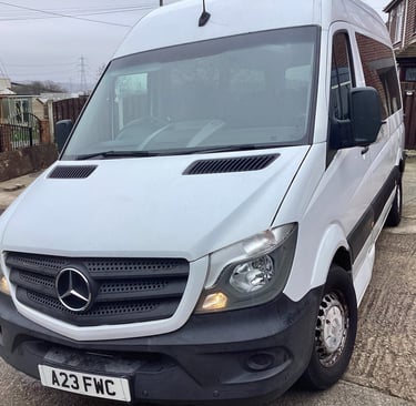 White Mercedes-Benz Sprinter van parked on a residential driveway in the UK.