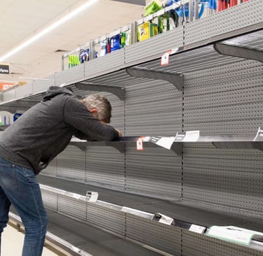a man is trying to get a picture of himself in the supermarket