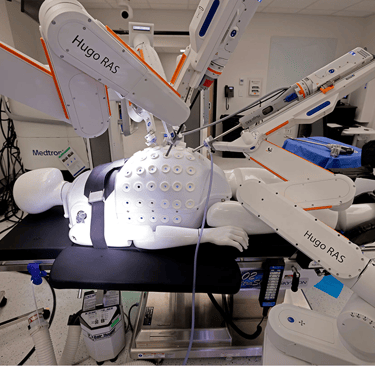 a robotic hand held up to a robotic hand