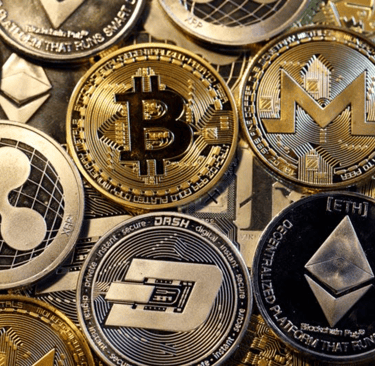 a bunch of bitcoin coins are shown on a pile of coins