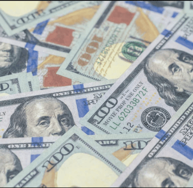 a bunch of money bills and dollars bills