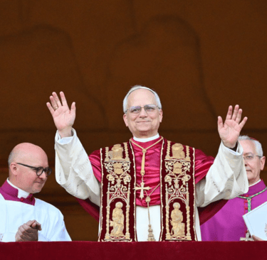 a priest with his hands up and his hands up